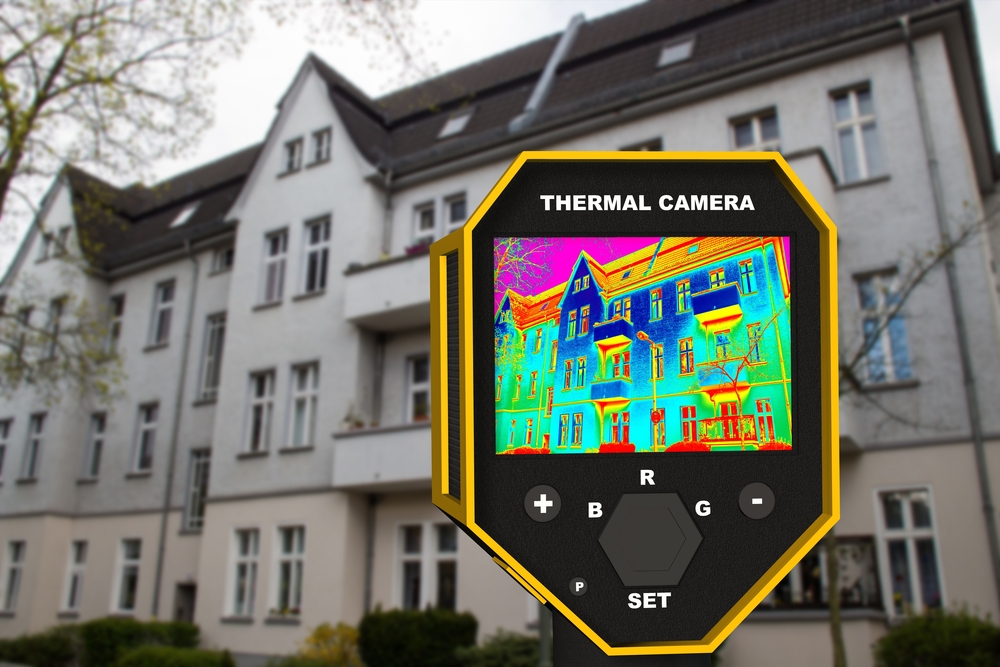 infrared thermal camer imager showing building facade-window heat loss-shut